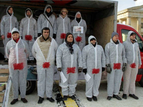 Eleven activists in Germany wear the bloodstained suit to protest penis mutilation